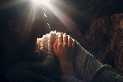 Close-up of couple relaxing in sunlight