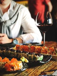 Close-up of wine glasses on table in restaurant