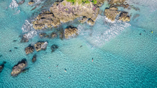 High angle view of rocks in sea