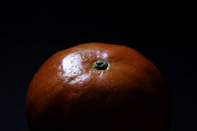 Close-up of fruit over black background
