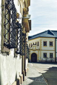 Street amidst buildings against sky