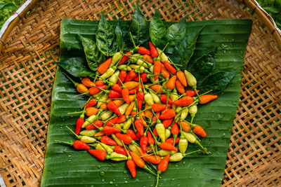 High angle view of red chili peppers in basket