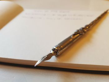 Close-up of pen on table