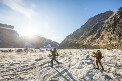 Two climber cross a glacier in auyuittuq national park