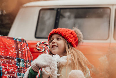 Portrait of young woman in car