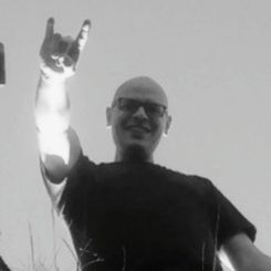 Portrait of man standing against white background