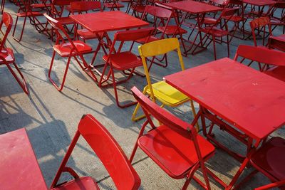 Empty chairs and tables arranging at sidewalk cafe