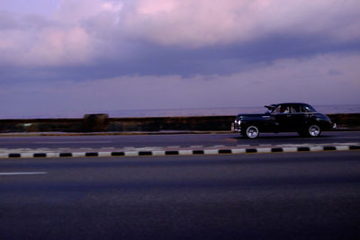 Car on road at dusk