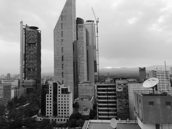 Modern buildings in city against sky