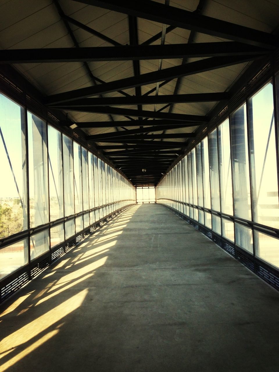 connection, bridge - man made structure, the way forward, diminishing perspective, built structure, architecture, transportation, vanishing point, engineering, long, bridge, railing, sky, footbridge, road, no people, metal, day, outdoors, sunlight