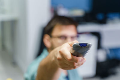 Portrait of young man using mobile phone