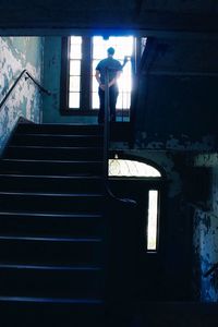 Low angle view of man on staircase