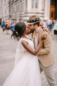 Couple holding umbrella