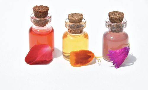 Close-up of various flowers in glass container