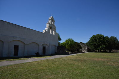 View of temple against clear blue sky