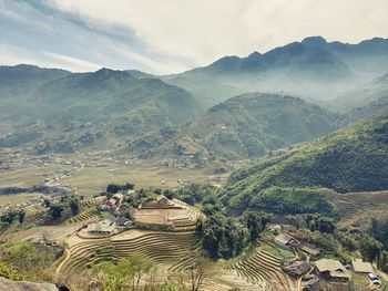 High angle view of agricultural field against mountains