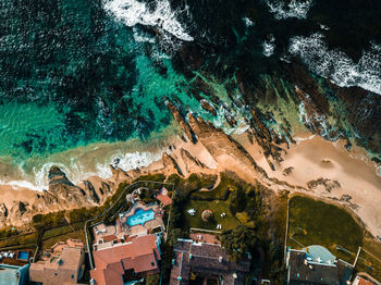 High angle view of trees by sea