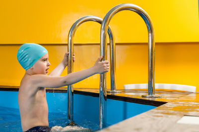 Side view of boy in swimming pool