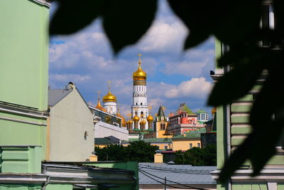 Buildings in city against sky