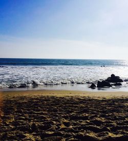 Scenic view of beach against clear sky