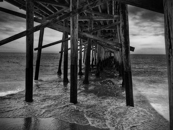 Pier on sea against sky