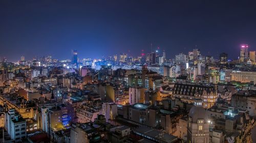 Illuminated buildings in city at night