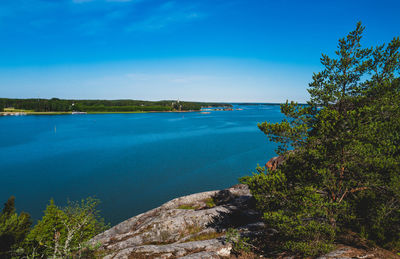 Scenic view of sea against blue sky