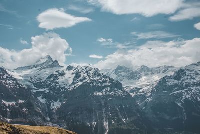 Scenic view of snowcapped mountains against sky