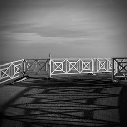 View of suspension bridge against cloudy sky