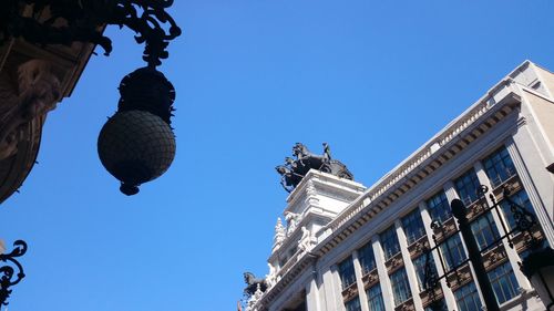 Low angle view of building against blue sky