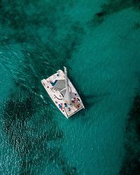 High angle view of sailboat sailing in sea