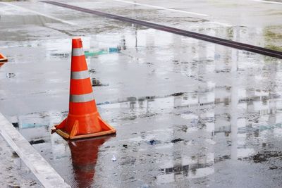 Traffic cone on wet road