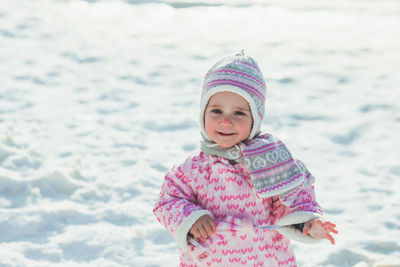 Portrait of smiling girl in snow