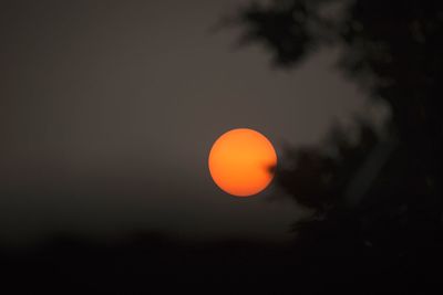 Scenic view of moon against sky at sunset