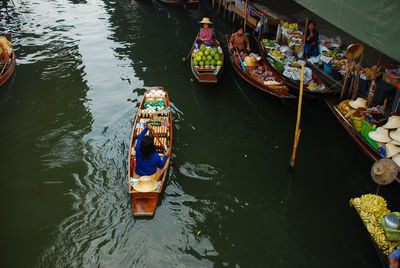High angle view of boats in river at market