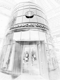 Low angle view of text on glass building