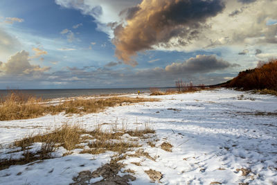 Scenic view of sea against sky during winter