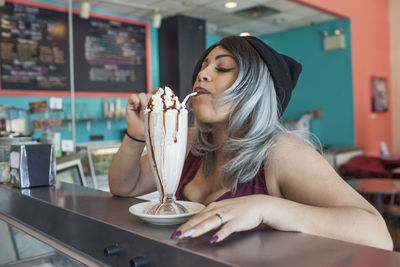 Young woman in a diner.