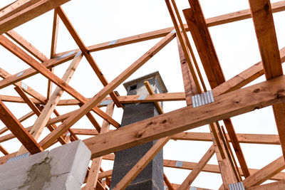 Low angle view of construction site against sky