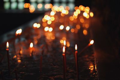 Lit candles in church