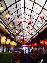 Low angle view of illuminated ceiling