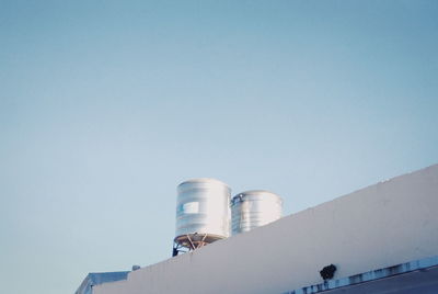 Low angle view of smoke stack against sky