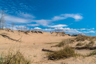 Scenic view of desert against blue sky