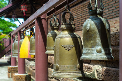 Close-up of old lantern hanging in temple