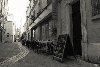 Empty alley amidst buildings in city