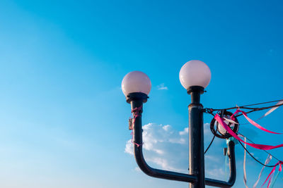 Low angle view of street light against sky