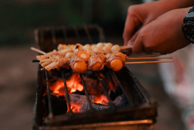 Cropped image of person preparing food