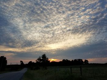 Scenic view of dramatic sky over field