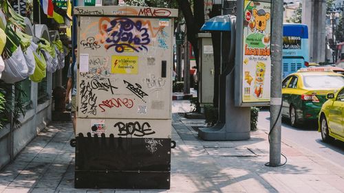 Graffiti on footpath in city