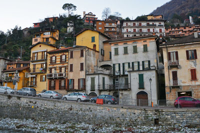 Houses in town against sky